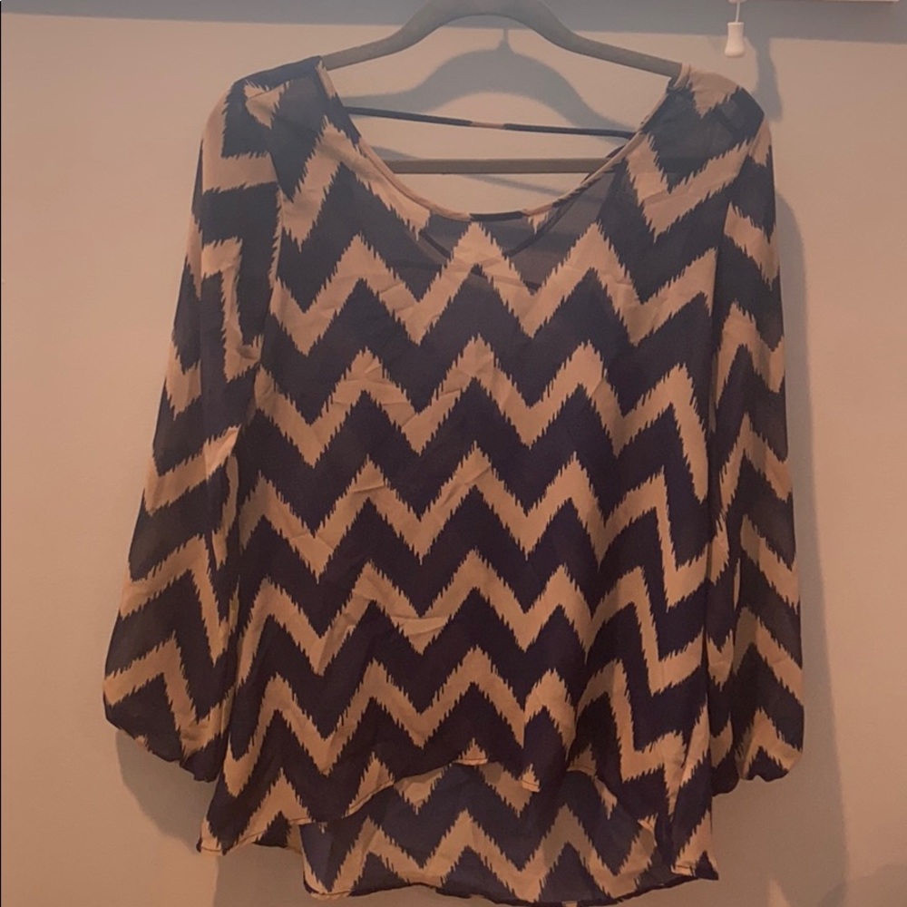 Sheer navy and tan top with open back detail